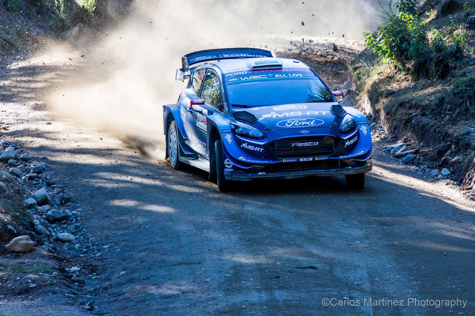 WRC Citroen power-sliding through dust